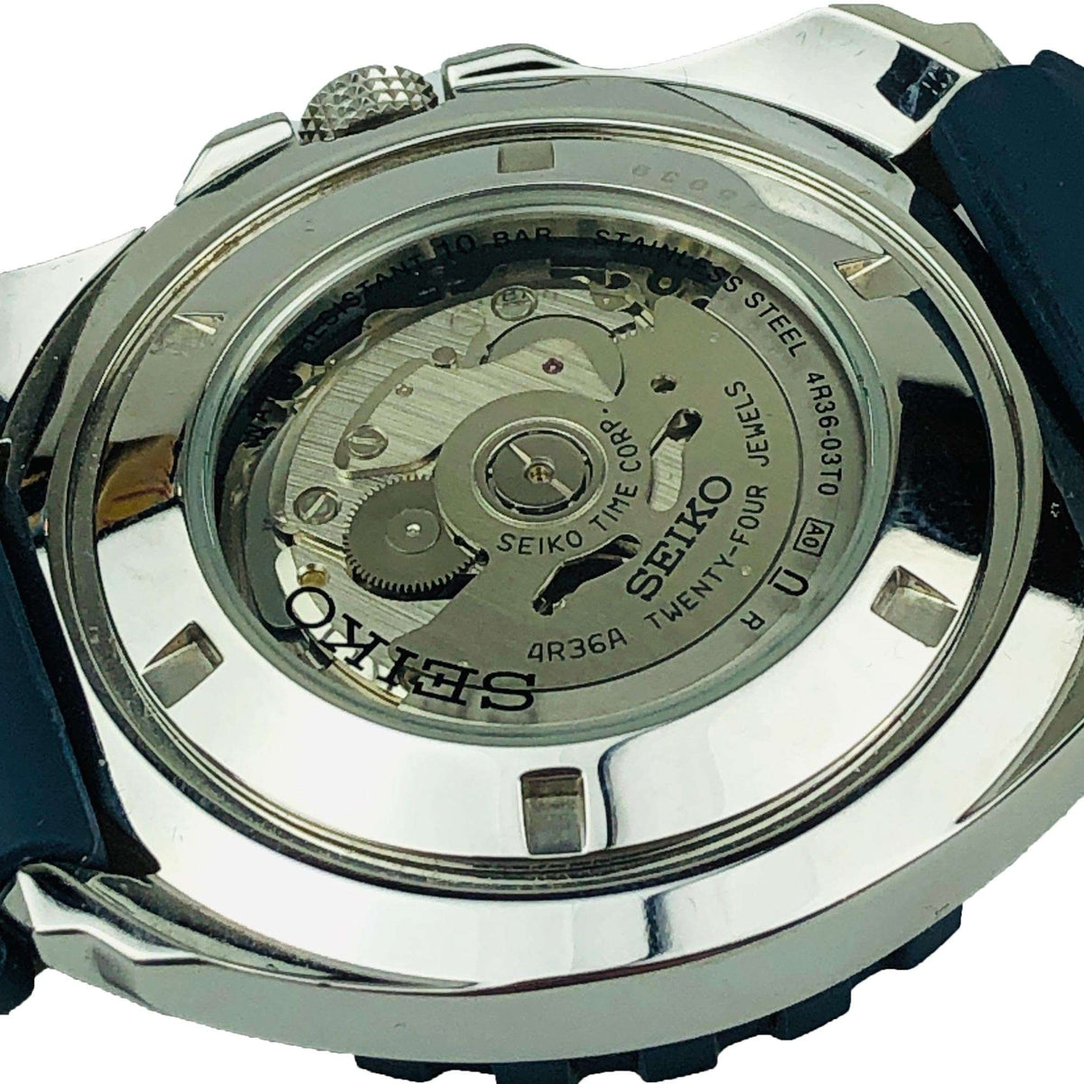 Seiko 5 Sports watch caseback with engraved mechanical details and 4R36A text