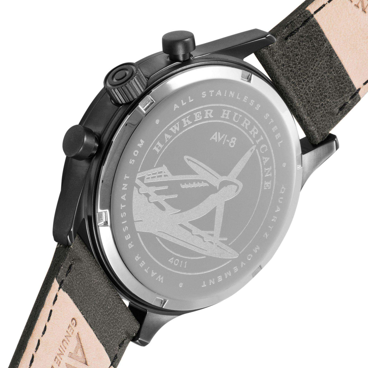 Mens chronograph watch case back with engraved airplane logo and dark grey leather strap