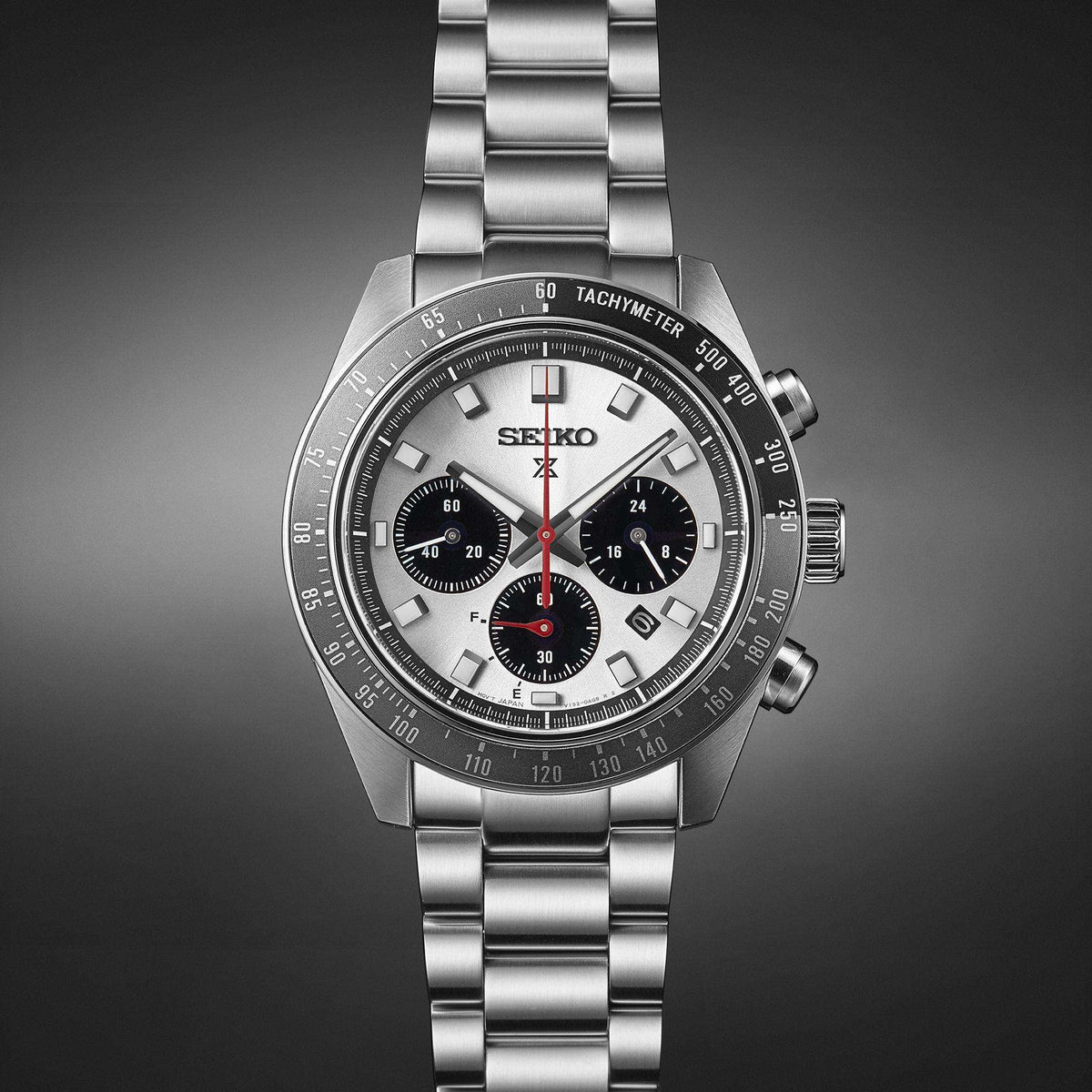 Stainless steel chronograph watch front view, silver dial with three subdials and tachymeter bezel