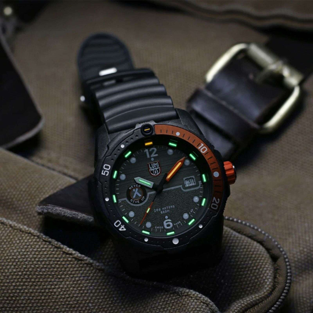 Men's black dial survival watch, orange bezel ring, black rubber strap