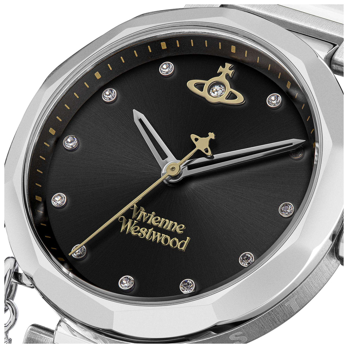 Stainless steel watch face close-up: black dial with gold cat hands and gem markers