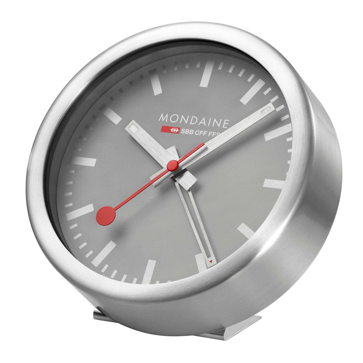 Mondaine quartz alarm clock with gray dial, red second hand, and brushed aluminum case