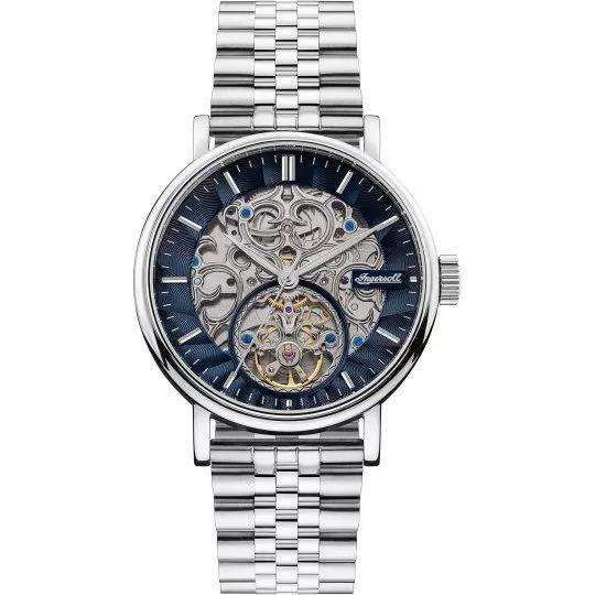 Automatic men’s watch with dark blue skeleton dial, silver case, and stainless steel band