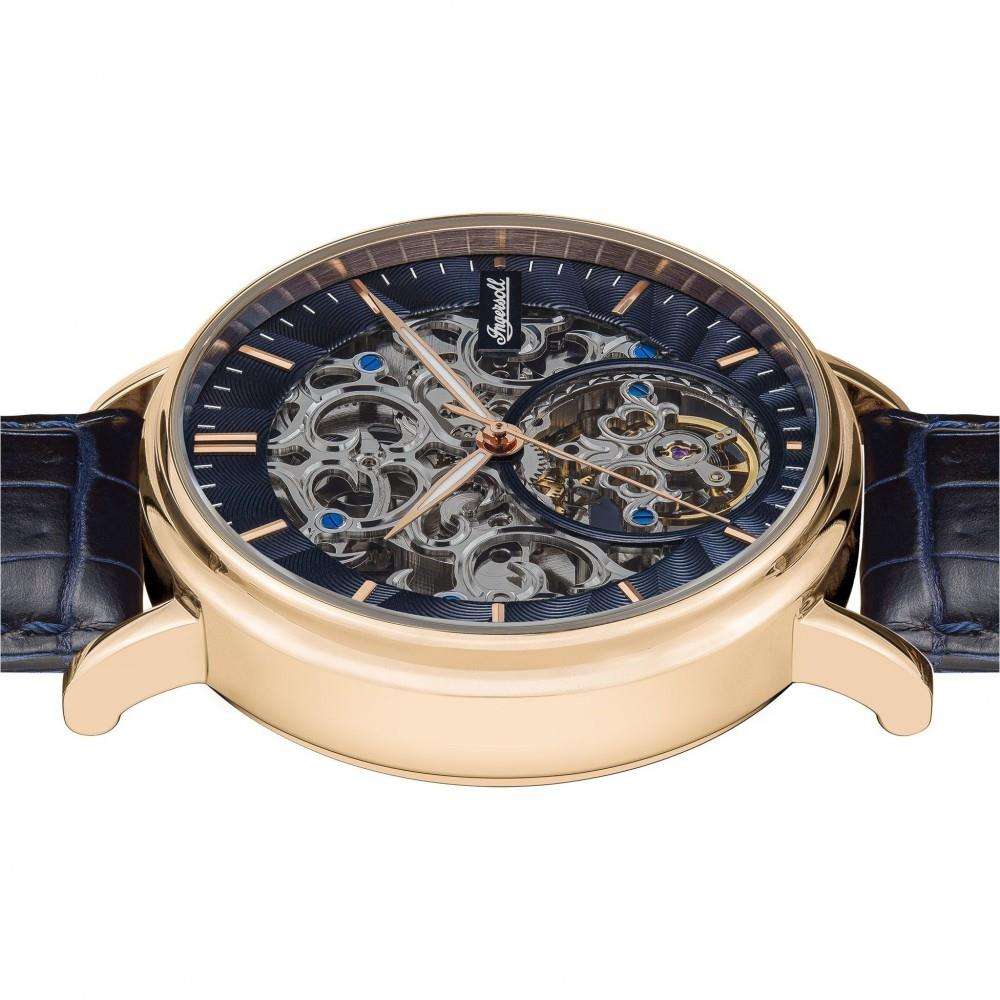 Men's automatic skeleton watch showing rose-gold case and visible mechanical movement through dial