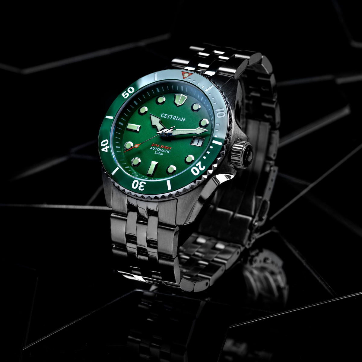 Angled view green dial dive automatic watch with steel bracelet and bezel