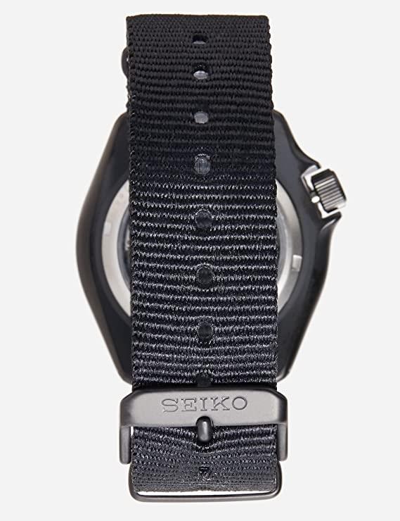 Seiko SRPD79K1 strap showcasing the black nylon strap and etched brand name on the buckle