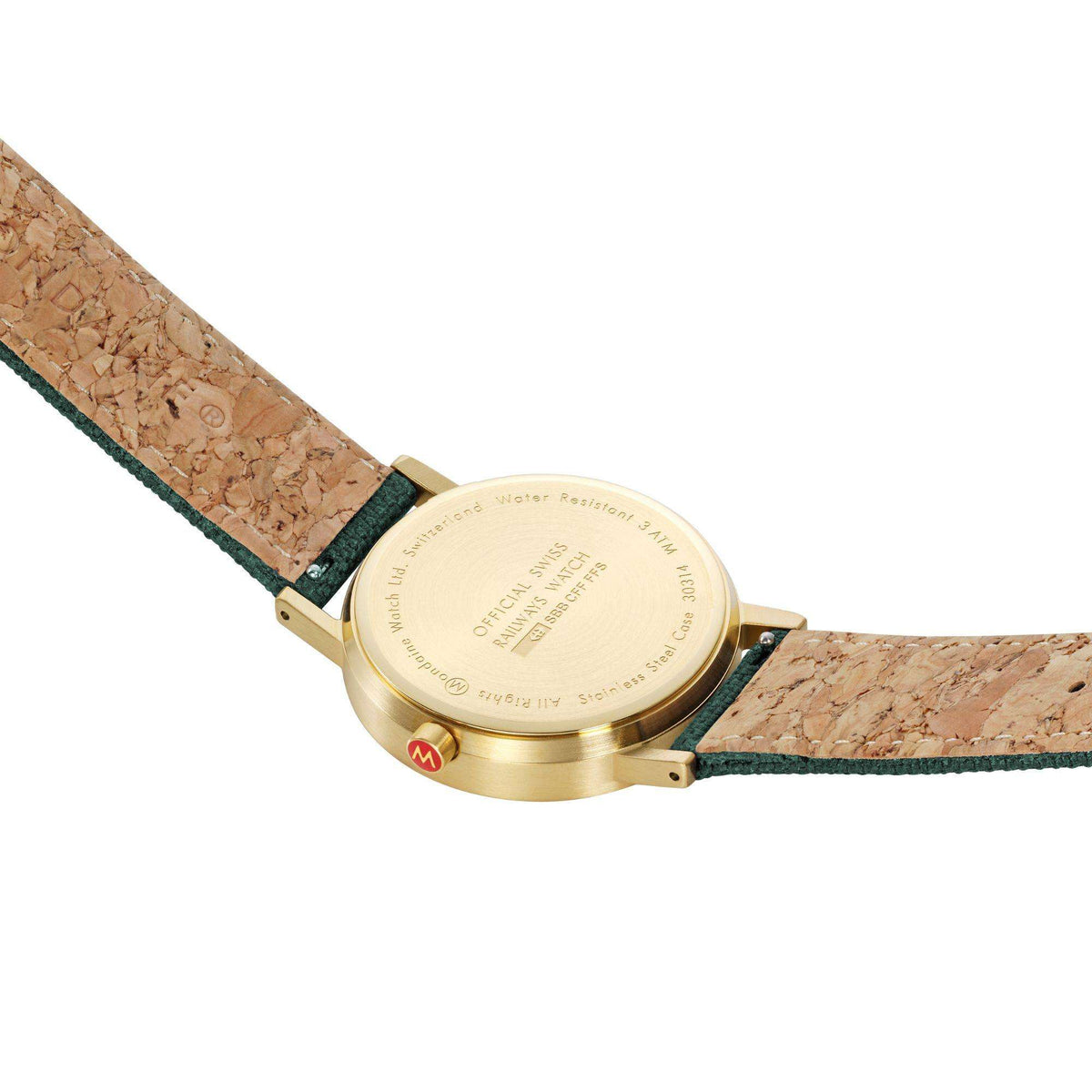 Back of gold-tone case forest green dial wrist watch with textured leather strap