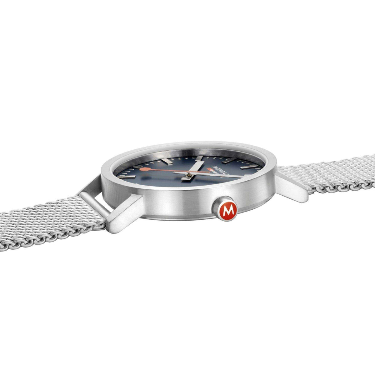 Mondaine steel watch case with blue dial and mesh strap, side view with crown