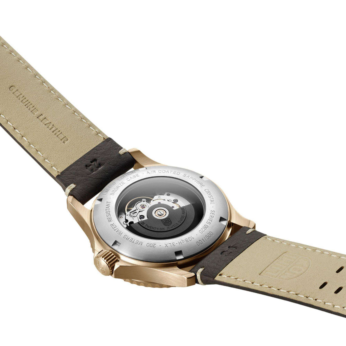 Men's automatic watch caseback with engraved details and light tan leather strap
