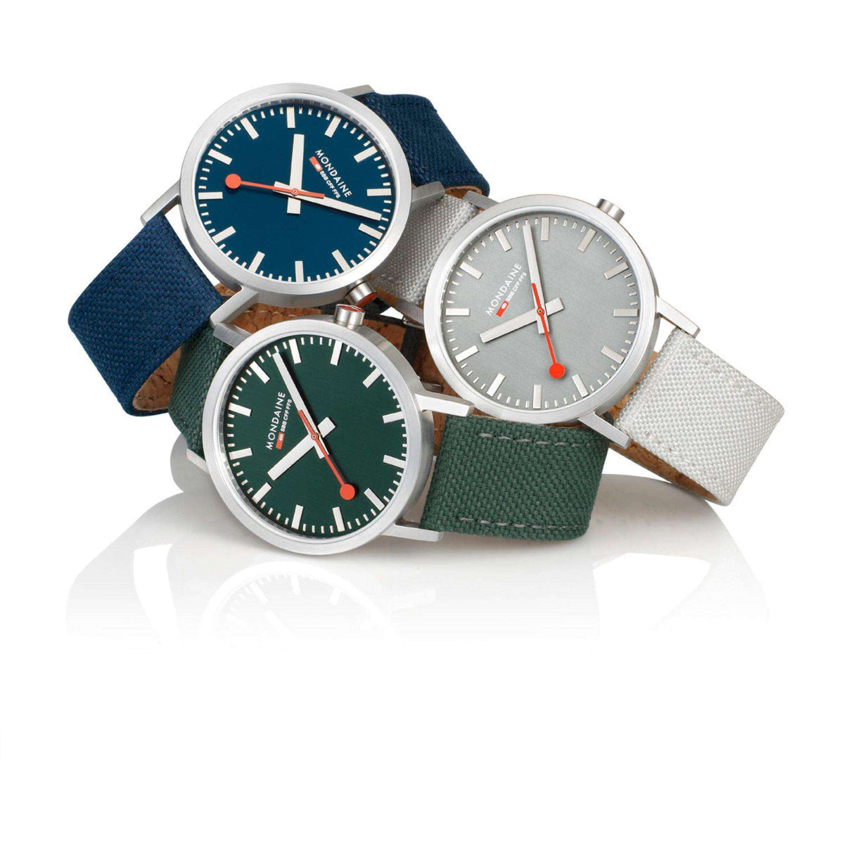 Mondaine Classic quartz watch with deep blue dial and red second hand, with other watches