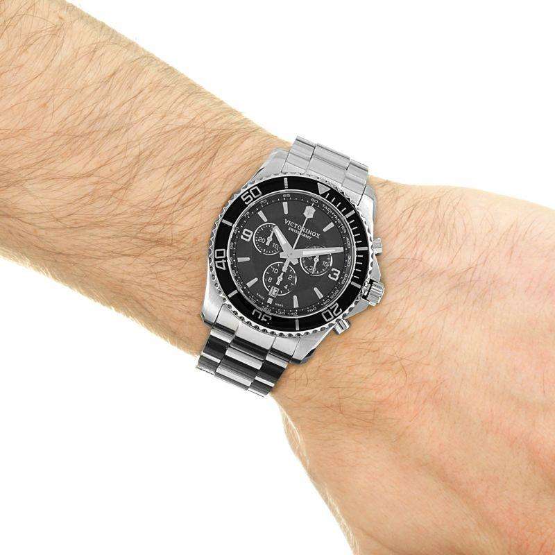 Men's stainless steel chronograph watch with black dial on wrist