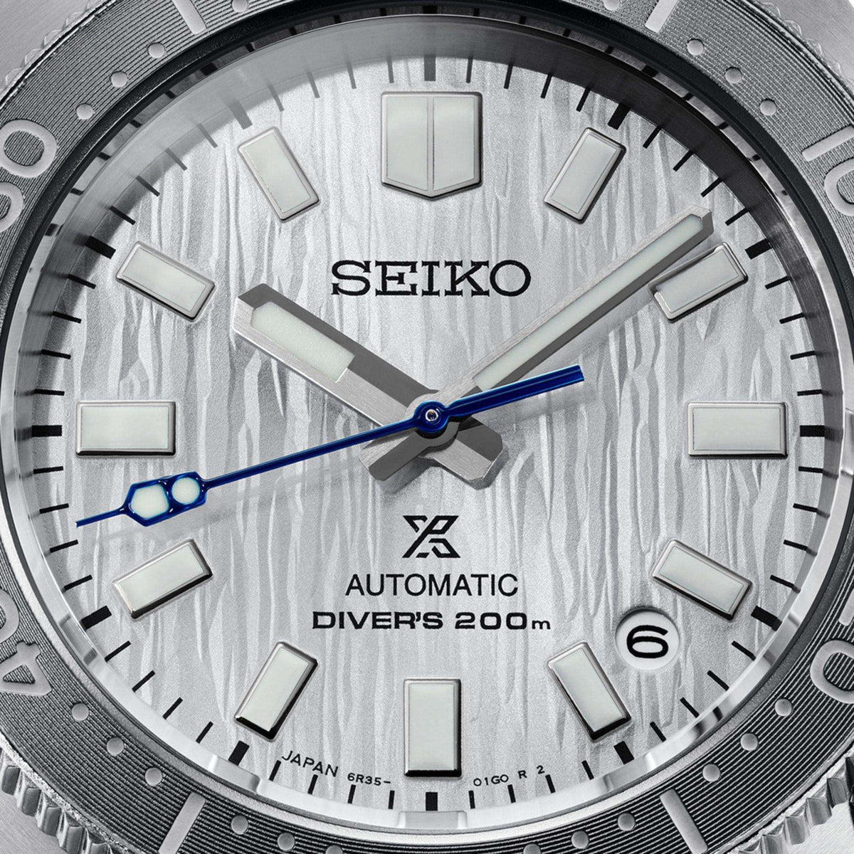 Seiko Prospex SPB333J1 watch with a silver dial and a blue second hand on a white background