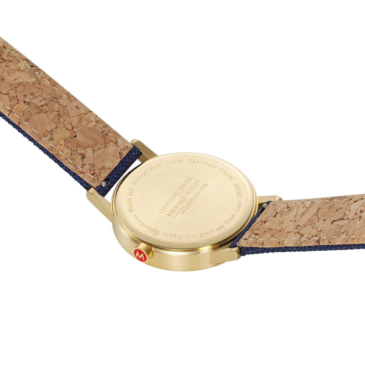 Mondaine Classic watch back view with gold-tone case and blue patterned fabric strap