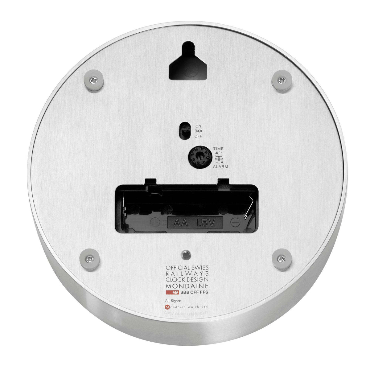 Back of silver table alarm clock with mounting battery compartment and bell icon