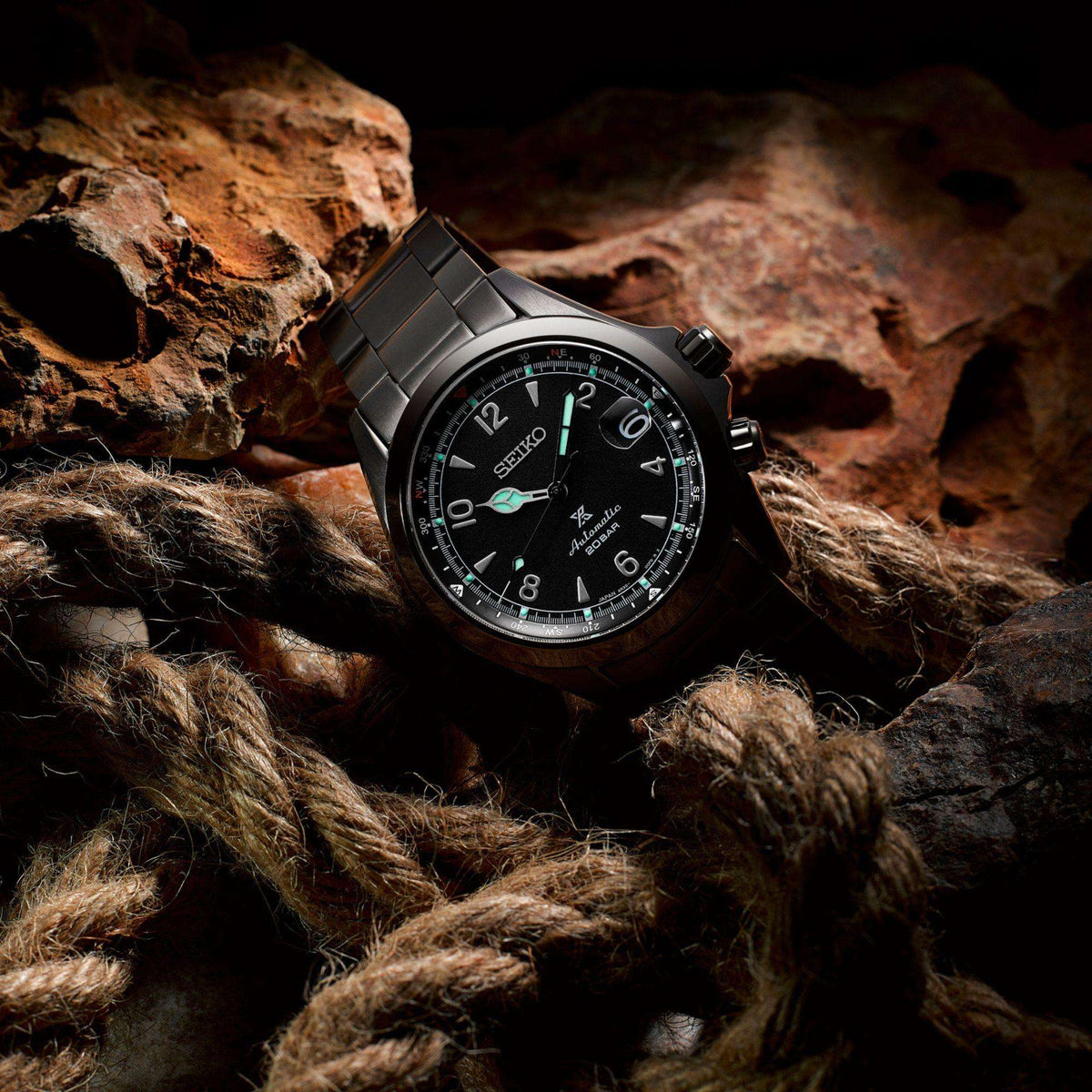 Seiko Prospex Black Series Night Alpinist watch SPB337J1 on a rope with a dark background