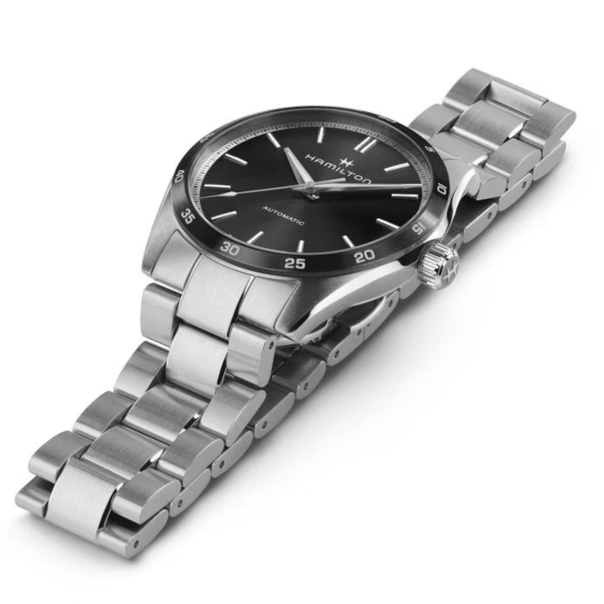 Men's automatic wristwatch with black dial and steel bracelet, angled side crown view.