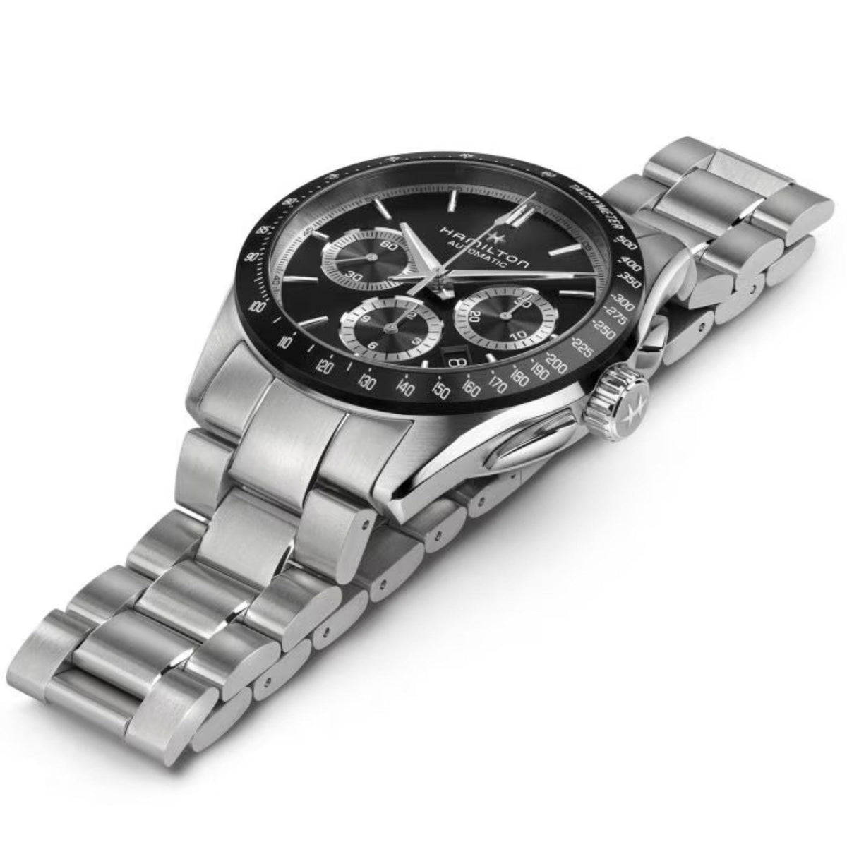 Men's chronograph watch angled view; black dial with tachymeter bezel, steel bracelet.
