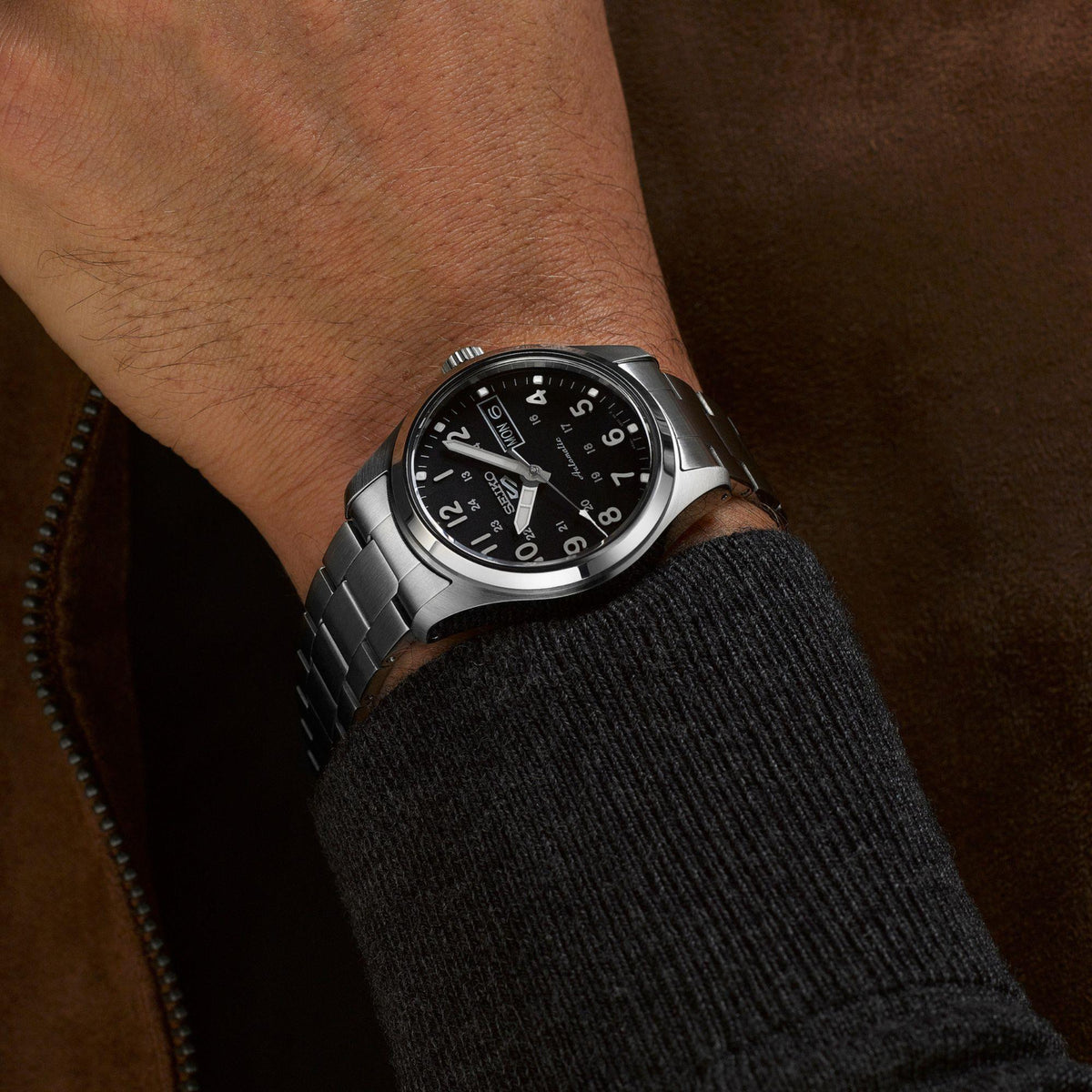 Seiko 5 Sports SRPJ81K1 stainless steel bracelet on wrist lifestyle view