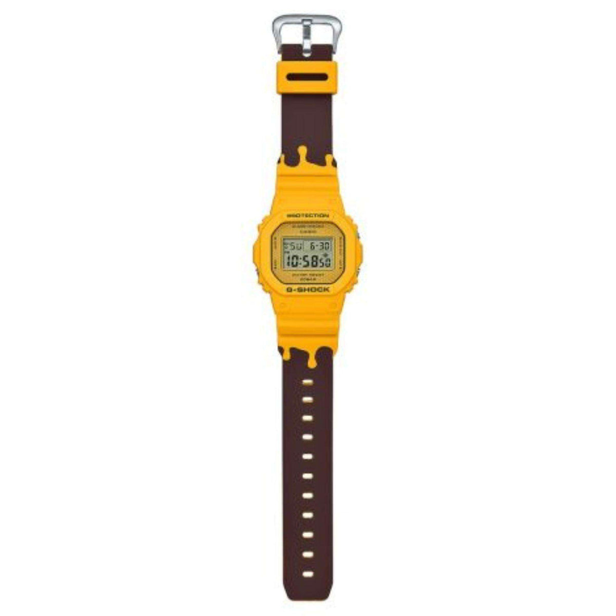 Digital G-Shock watch with yellow case and two-tone rubber strap, buckle clasp
