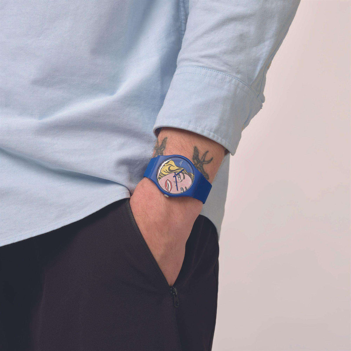 Blue silicone strap wristwatch with round comic portrait face