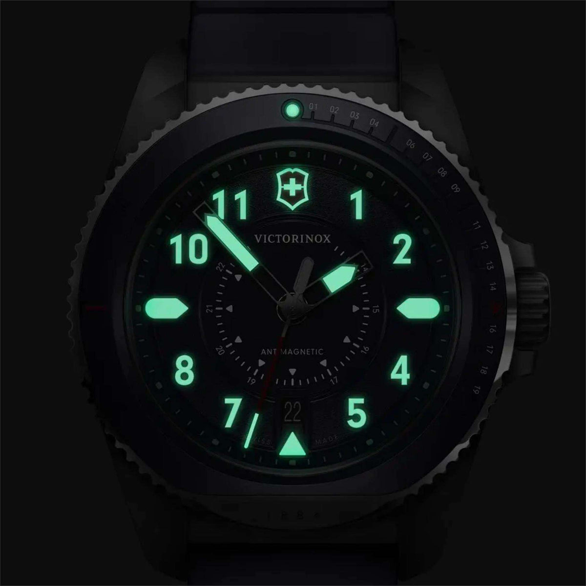 Men's blue dial quartz watch with glowing green markers on dark dial