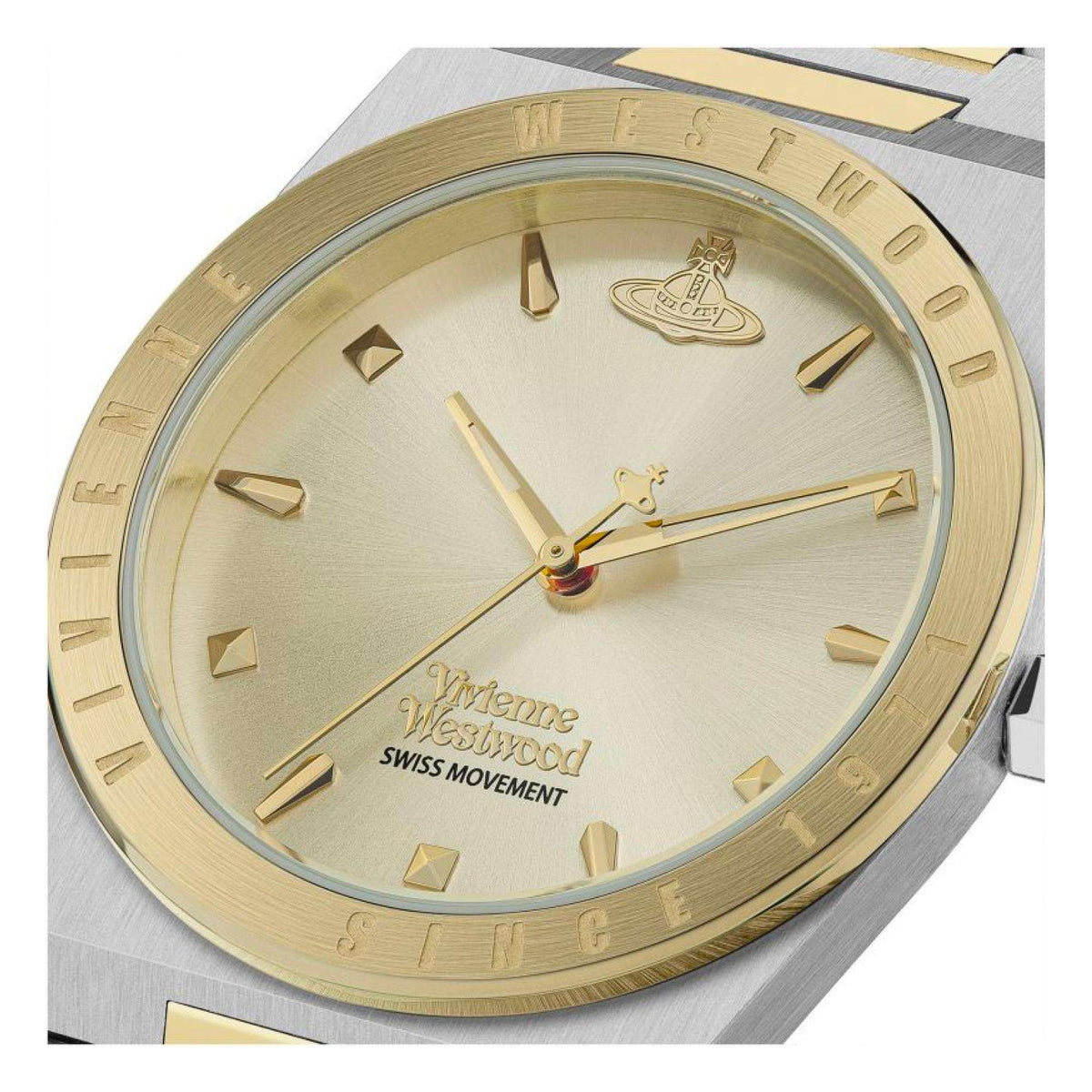 Champagne dial watch close-up with gold-tone hour markers and hands