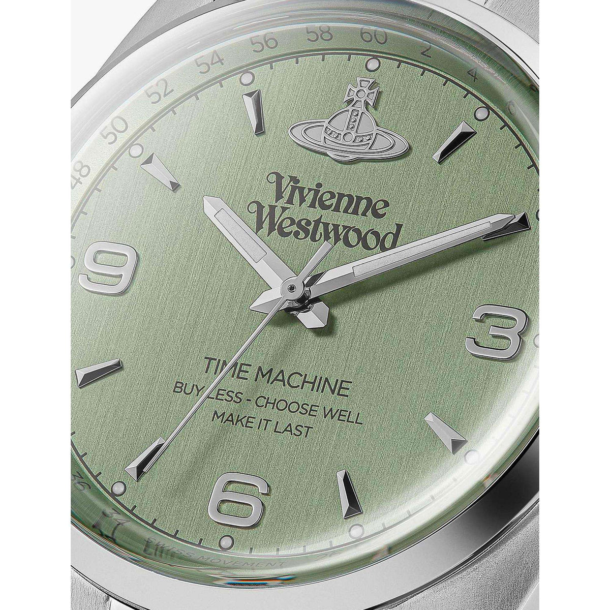 Close-up of green dial wrist watch with Vivienne Westwood logo, silver hour markers