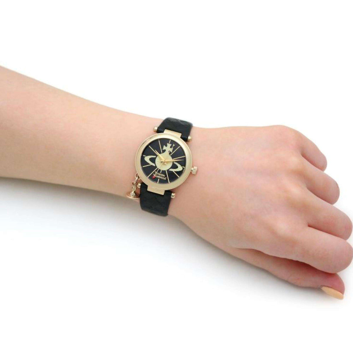 Vivienne Westwood Orb II quartz watch VV006BKGD with black leather strap, gold-tone case, and black dial on wrist