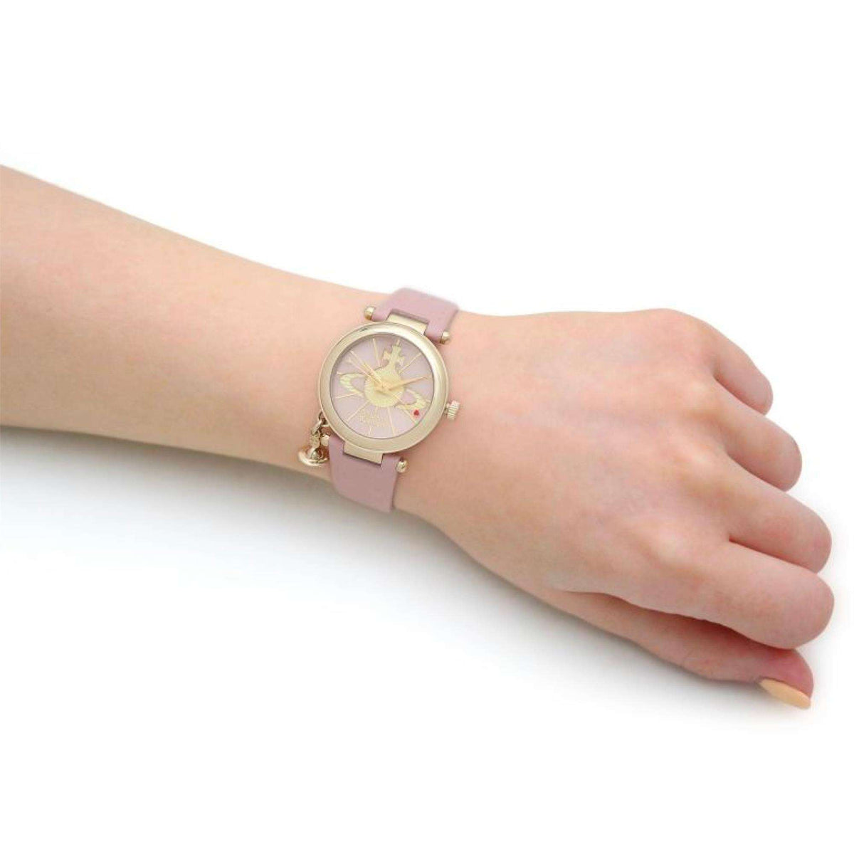 Vivienne Westwood Orb II VV006PKPK ladies wrist watch worn on wrist showing pink dial and compact 32mm case profile