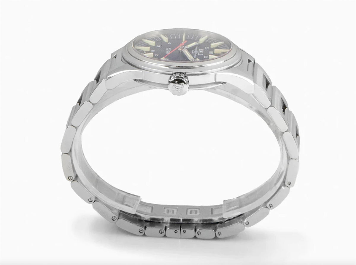Stainless steel watch caseback and metal link bracelet, crown not visible