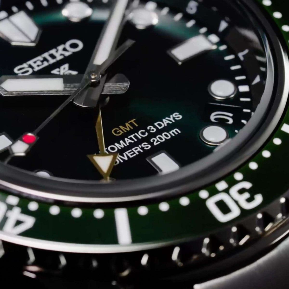 Seiko Prospex SPB381J1 green dial text and hands close up