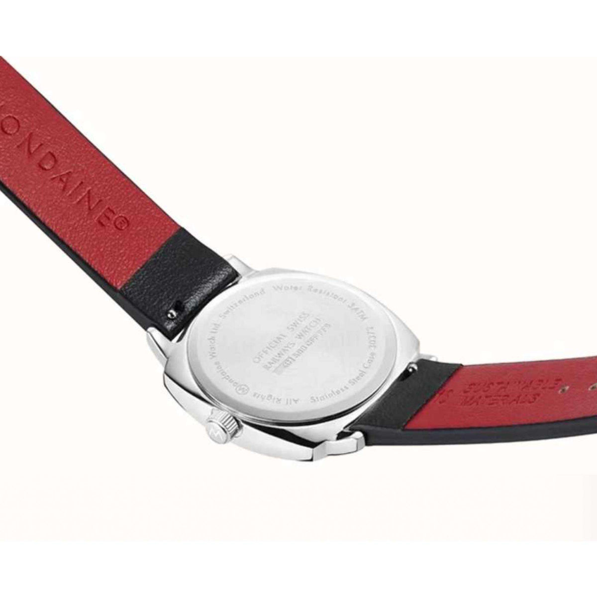 Mondaine Petite Cushion MSL.31110.LBV back case view highlighting engraved brand text and leather strap lining