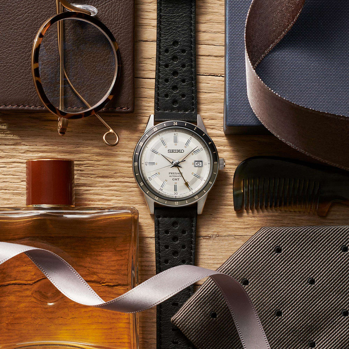 Seiko Presage Stone Style 60s Road Trip GMT SSK011J1 flat lay with lifestyle accessories