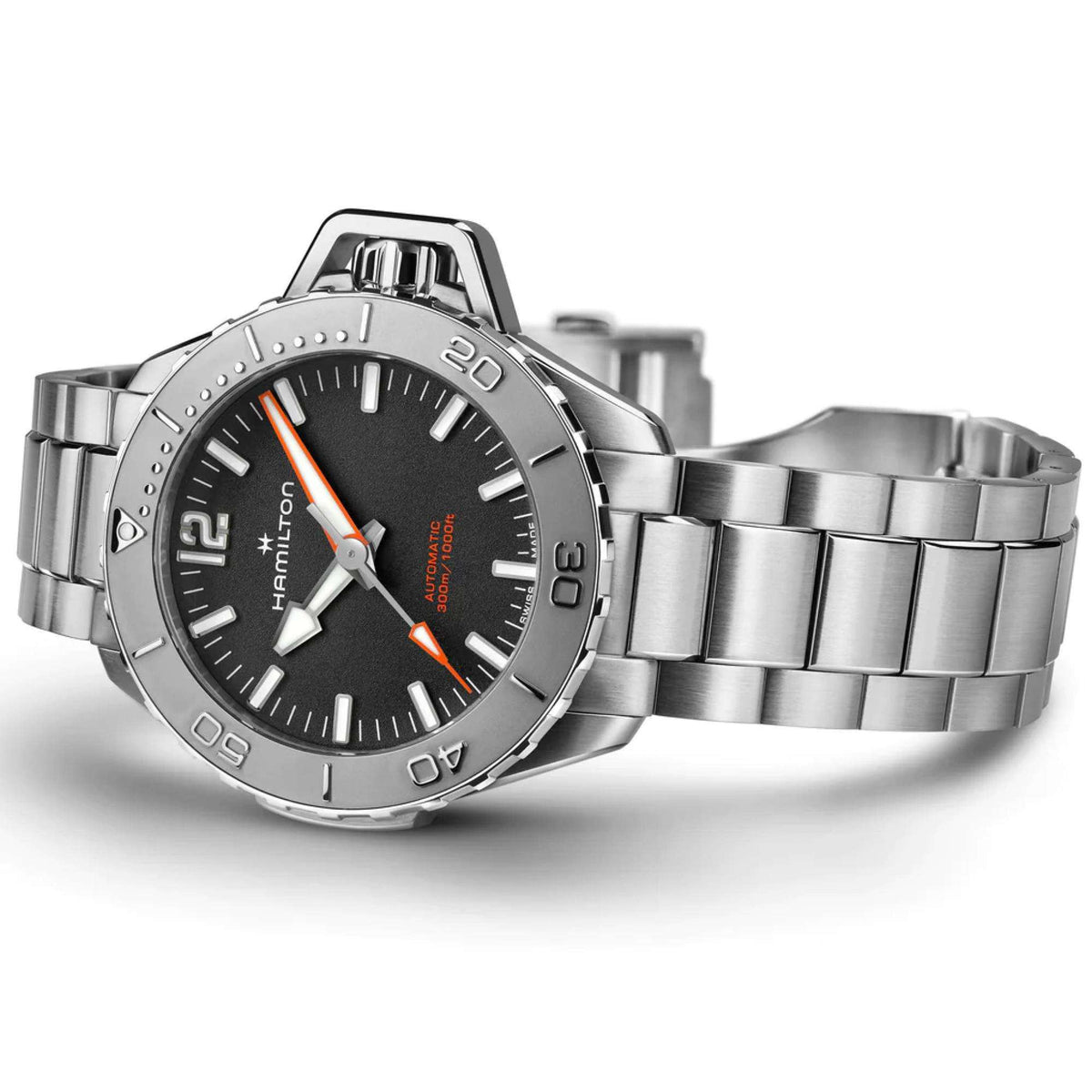 Men’s steel automatic watch with black dial, orange accents, and link bracelet