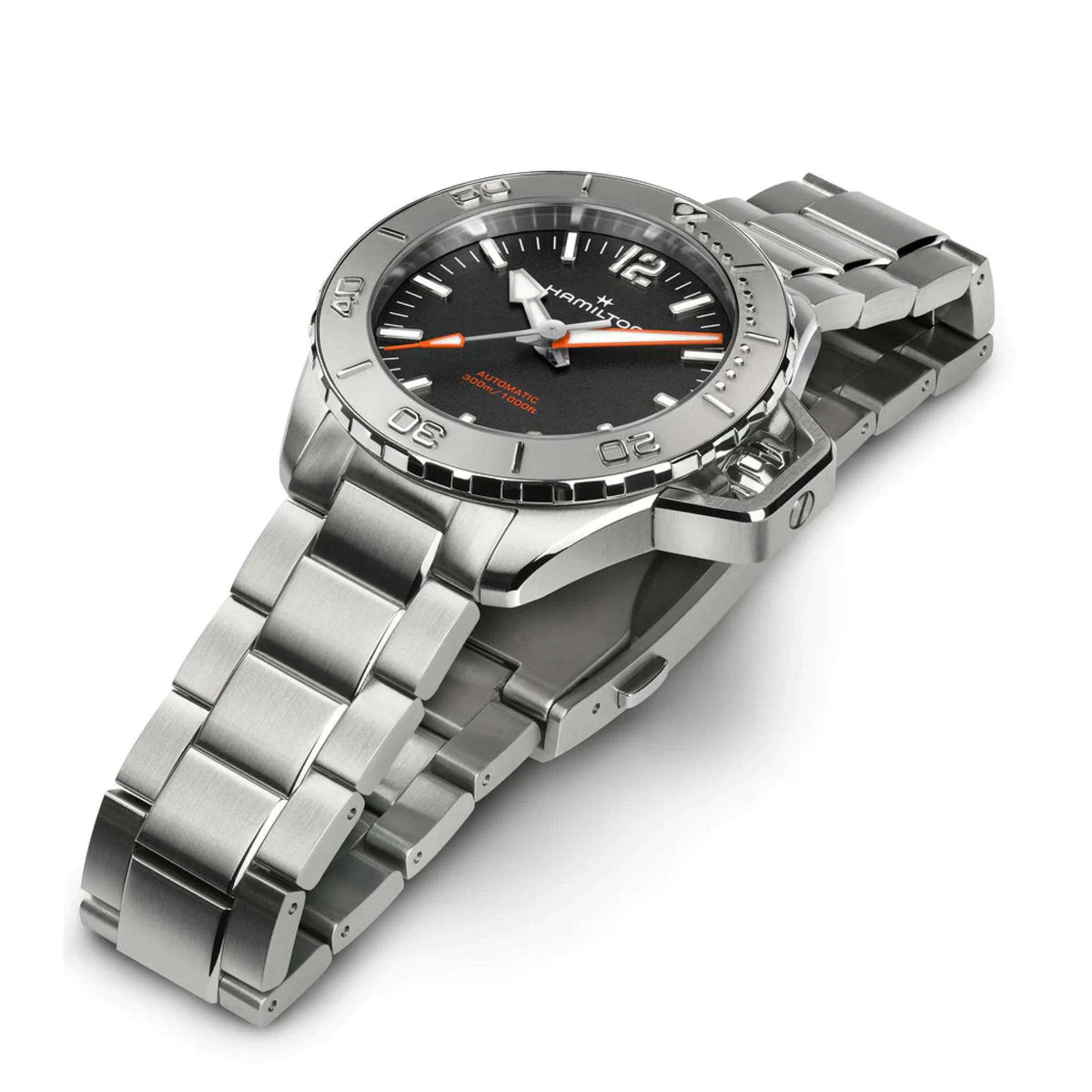 Men’s steel watch with black dial, orange hands, and metal link bracelet