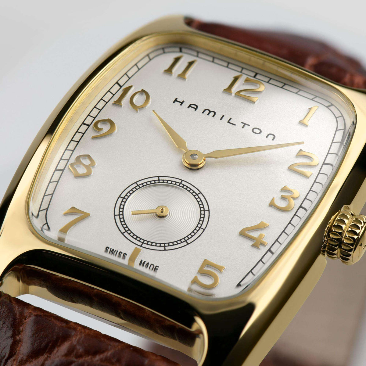 Hamilton American Classic Boulton H13431553 Swiss quartz wristwatch macro close-up showcasing white dial, sub-seconds display, and gold numerals