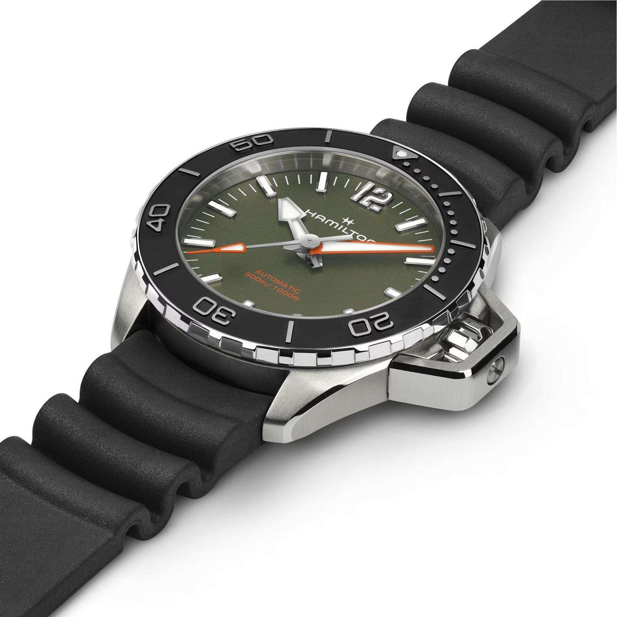 Diver watch with green dial, black rubber strap, and stainless bezel and clasp