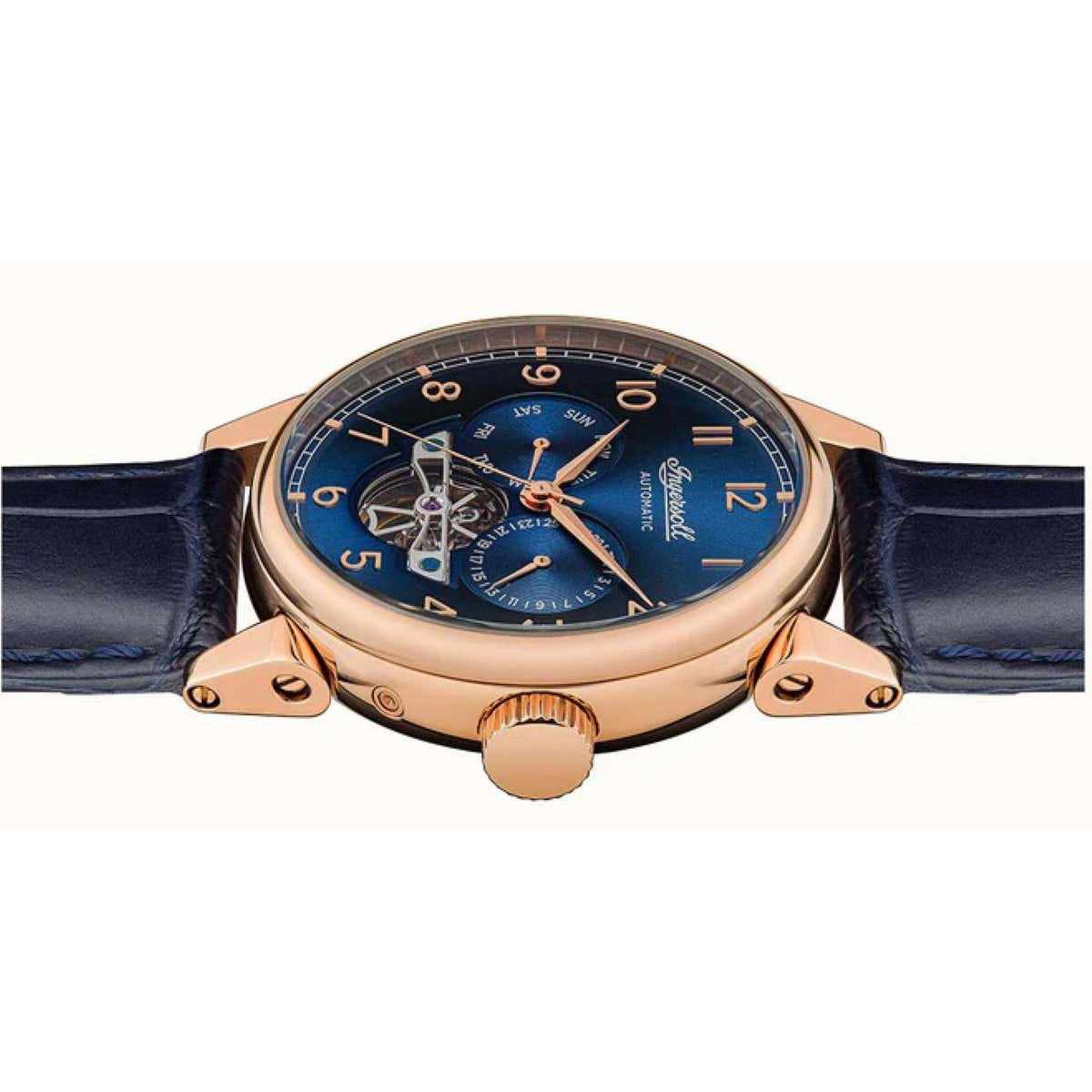 Watch front view from slight angle showing blue dial and rose gold case