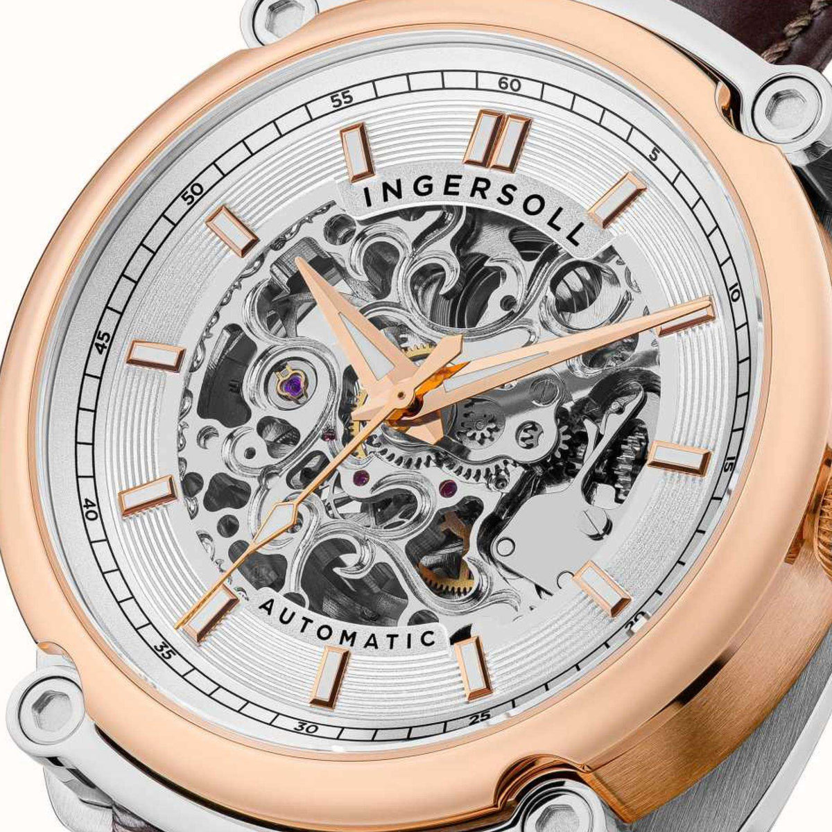 Men's automatic skeleton watch close-up: white dial with visible movement, brown leather strap.