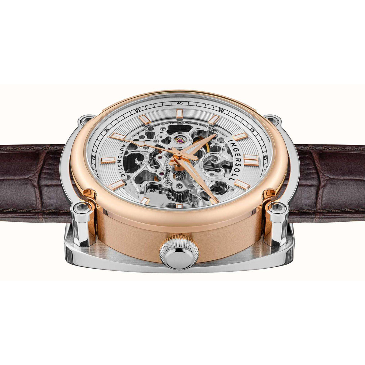 Men's automatic skeleton watch case side view with brown leather strap and visible movement.