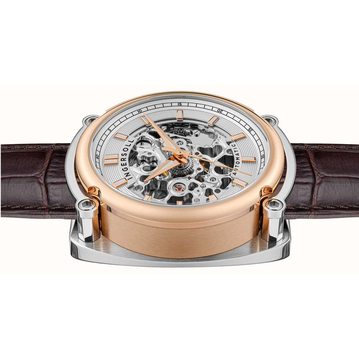 Men's automatic skeleton watch angled view: white dial, silver case, rose-gold bezel, brown strap.
