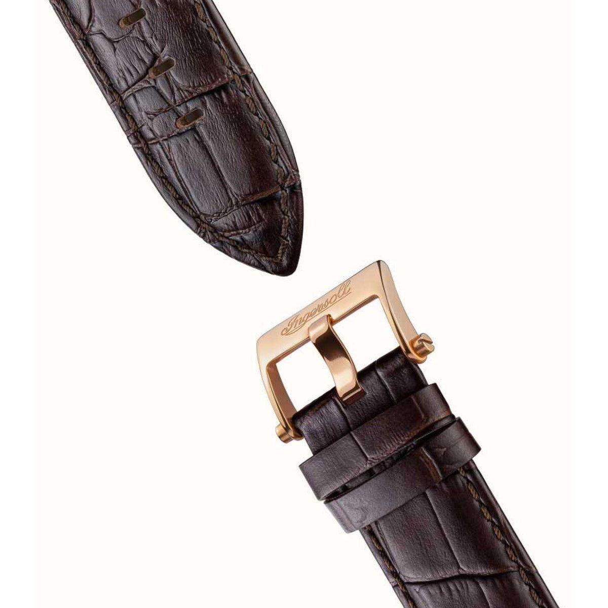 Brown leather watch strap with gold-toned buckle and strap stitching.