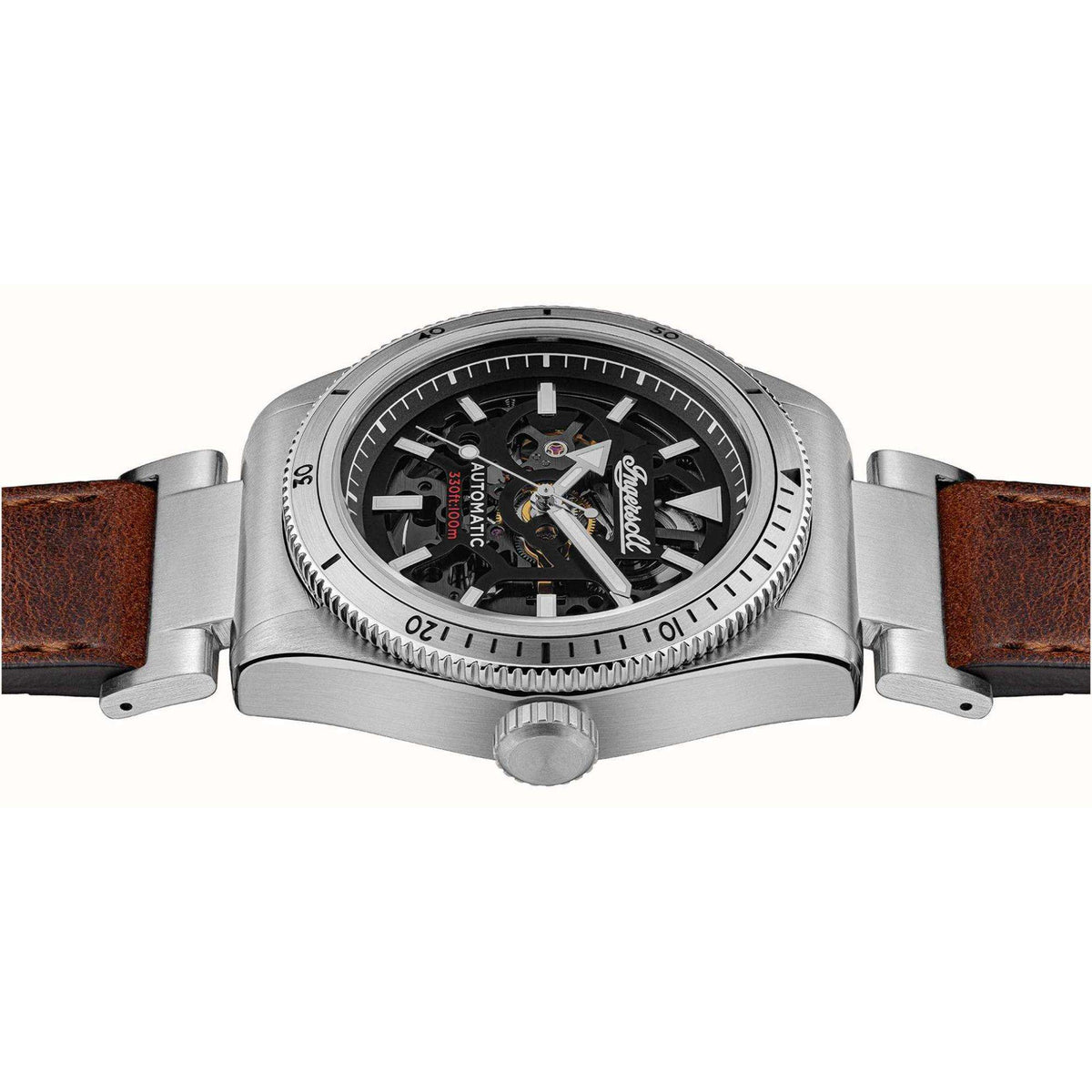 Men's automatic wristwatch side view, black skeleton dial, silver case, brown leather strap.