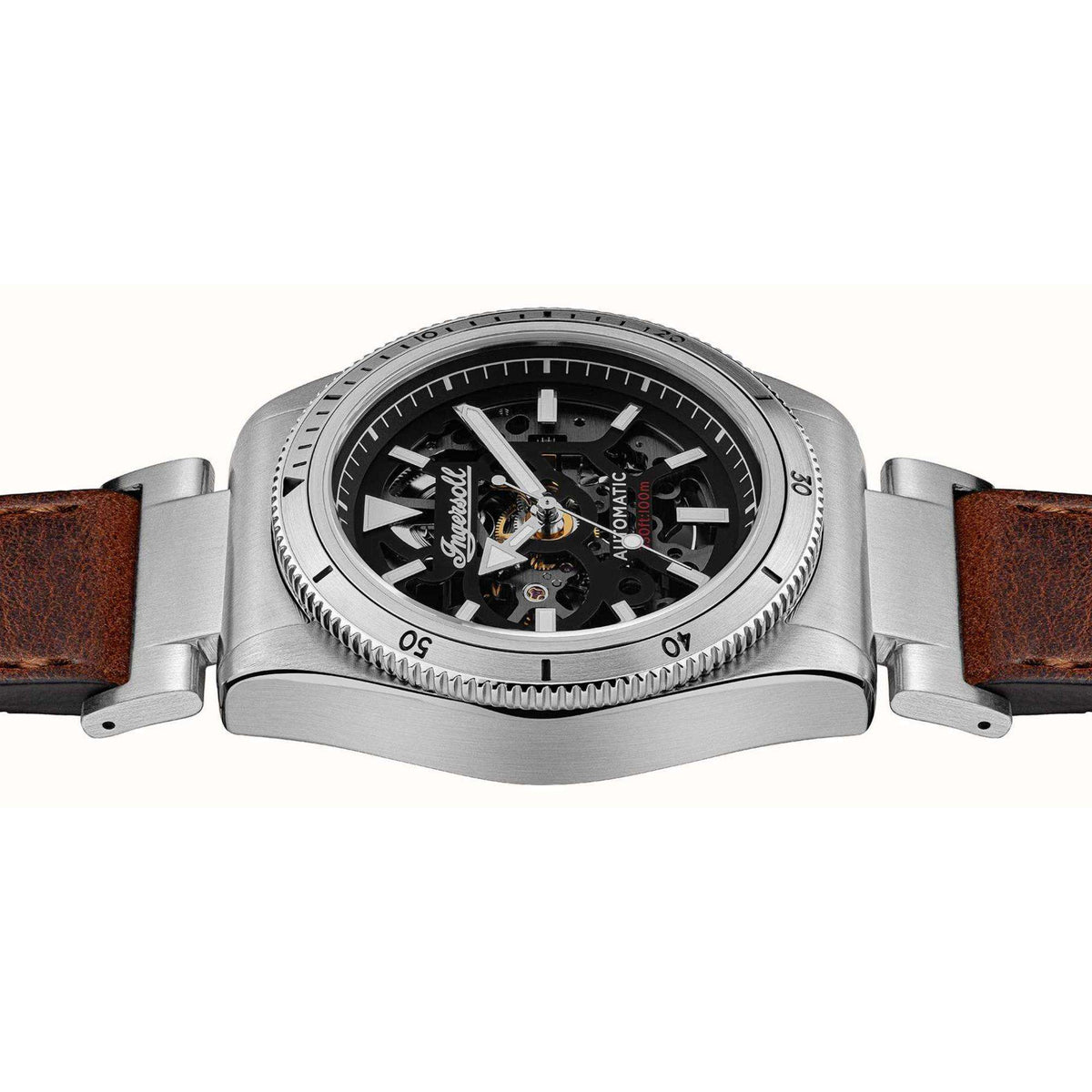 Men's automatic wristwatch angled view, black skeleton dial in silver case, brown leather strap.