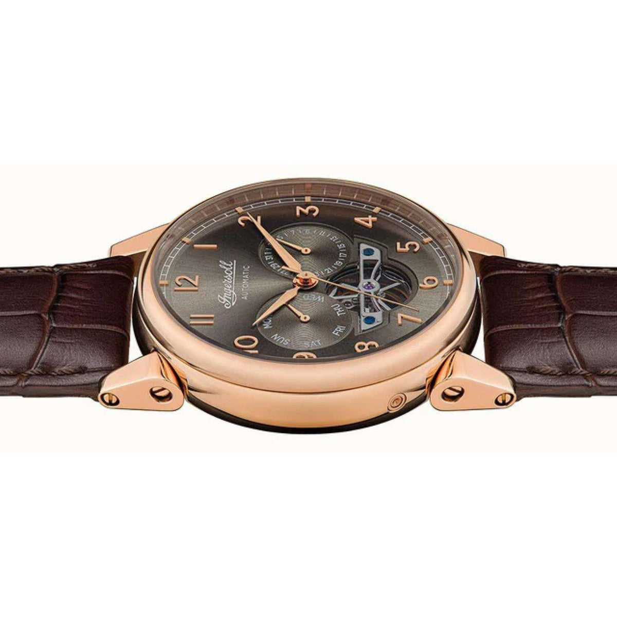 Men's automatic watch front view with rose-gold case, dark dial, and exposed movement details