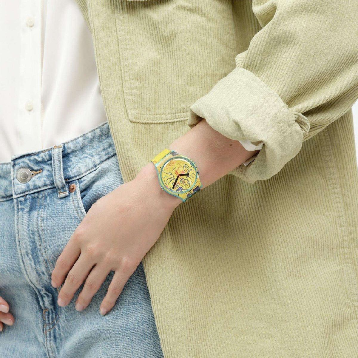 Quartz watch on wrist with yellow illustrated dial and matching yellow strap