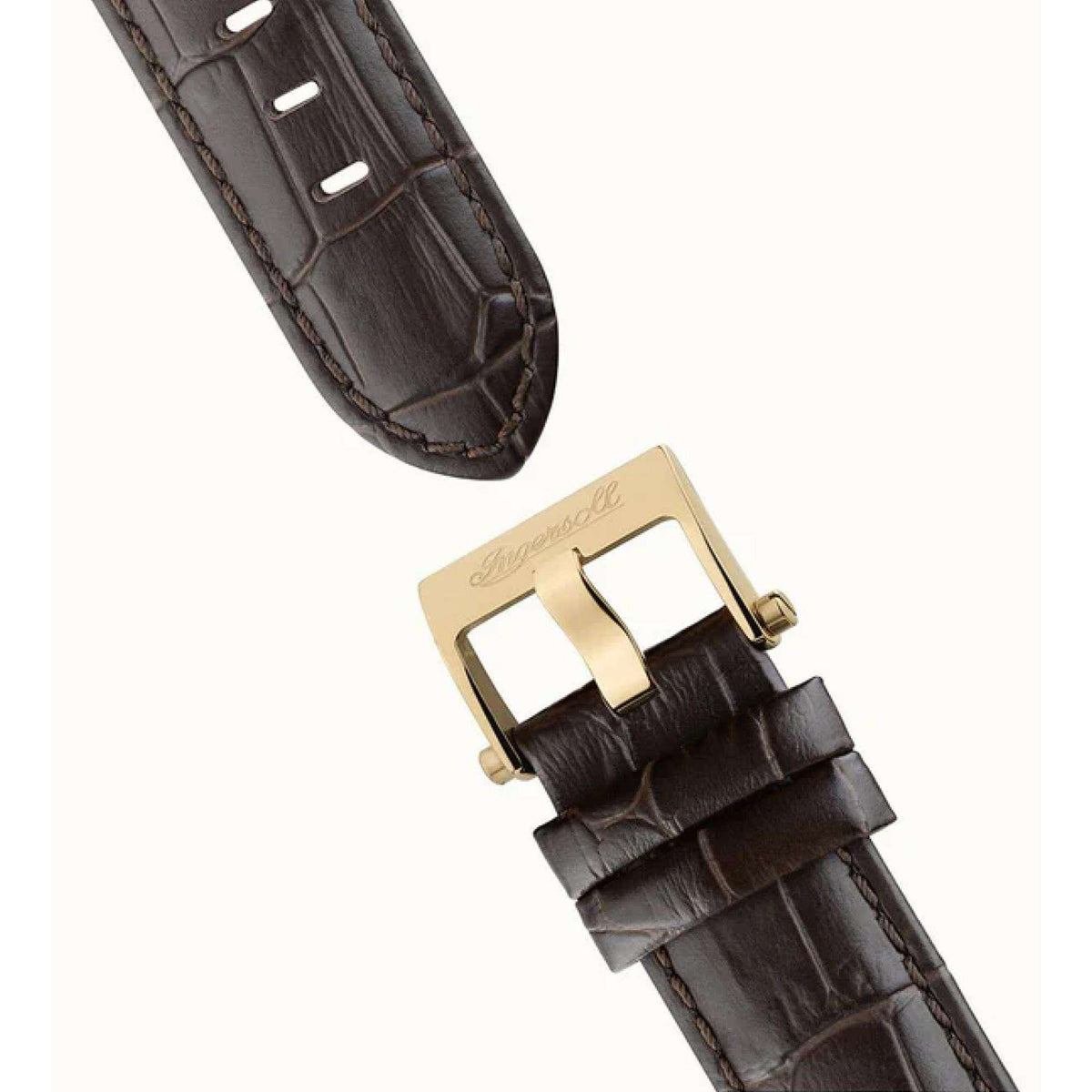 Brown leather watch strap with gold-tone buckle and keeper on men’s automatic watch