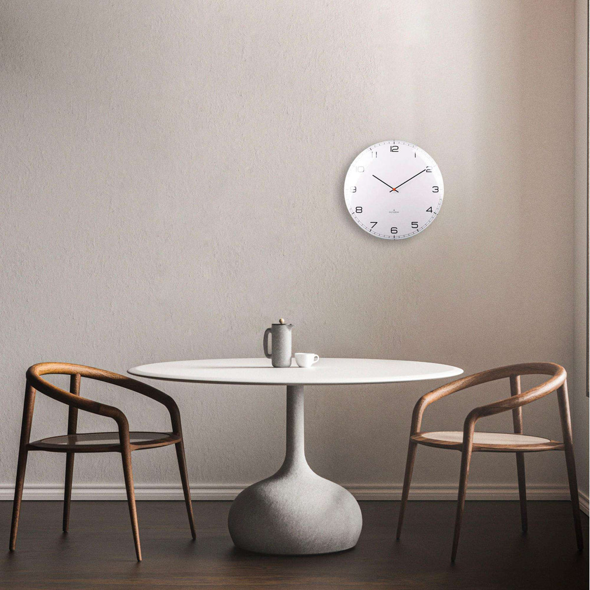 White dome wall clock with round glass cover, black hour markers, and black hands