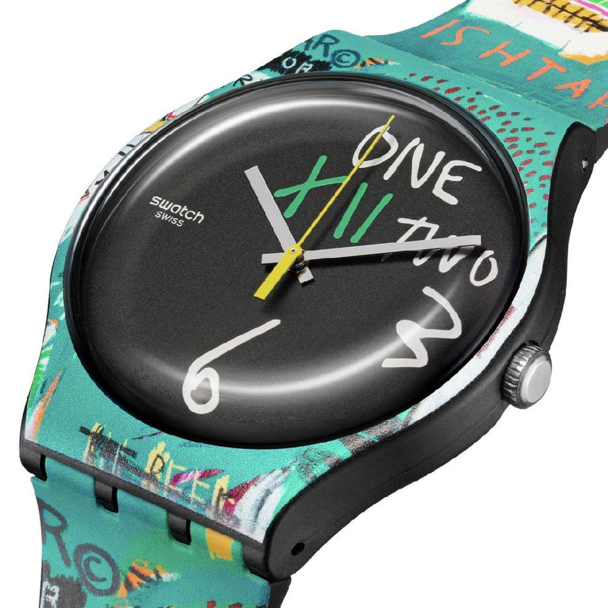 Round black dial quartz watch with white numerals and multicolor teal graphic strap