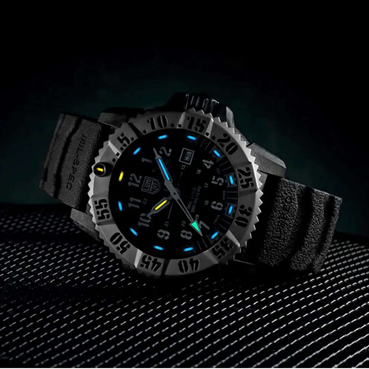 Luminox MIL-SPEC quartz watch with blue glow markers on black textured strap